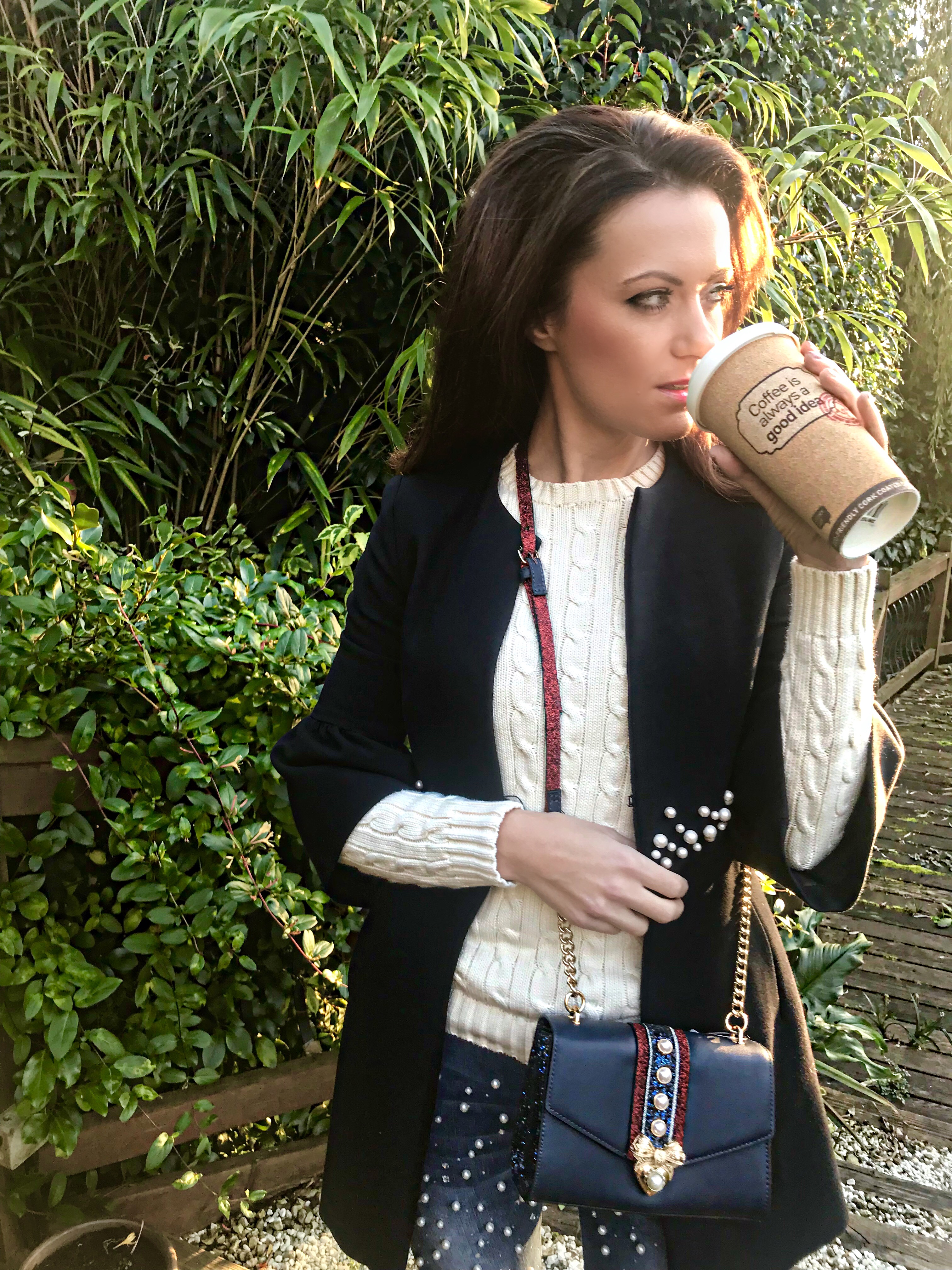 KG by Kurt Geiger Bow Pearl Detail Court Shoes, ALDO Pearl Detail Mini Cross Body Bag, Ralph Lauren Cable-Knit Crewneck Sweater and a pearl detail jacket from Zara.