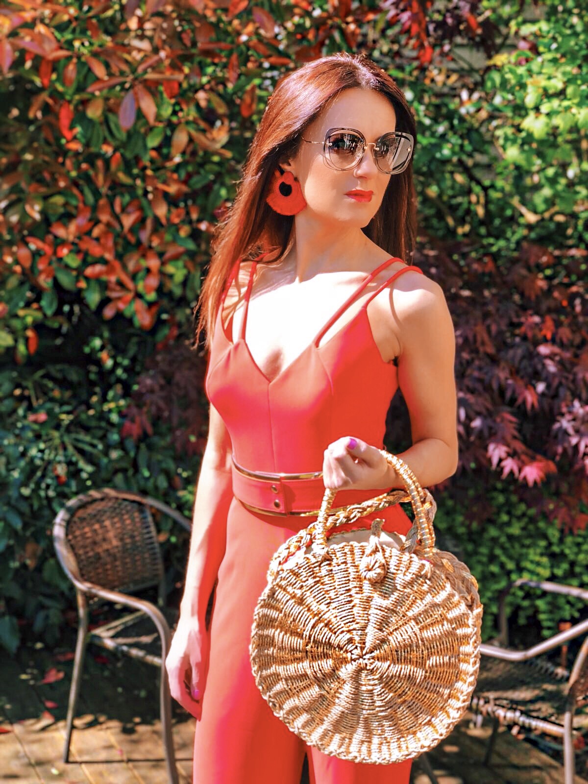 BROOKE - BRIGHT CORAL DOUBLE STRAP JUMPSUIT WITH GOLD WAISTBAND | South Beach Round Gold Woven Straw Cross Body Bag | Elegant Duchess Boutique Bohemian earrings