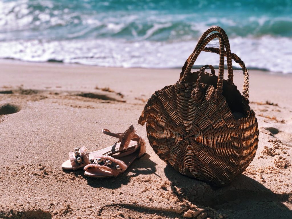 Cancun Mexico | Secrets the Vine hotel Forever Unique Structured One Shoulder Skater Dress With Lace Inserts | Glamorous Pearl Embellished Satin Sandals | Swarovski hoop earrings | Miu Miu sunglasses | ASOS DESIGN Wrapped Bead & Tassel Earrings | South Beach Round Gold Woven Straw Cross Body Bag