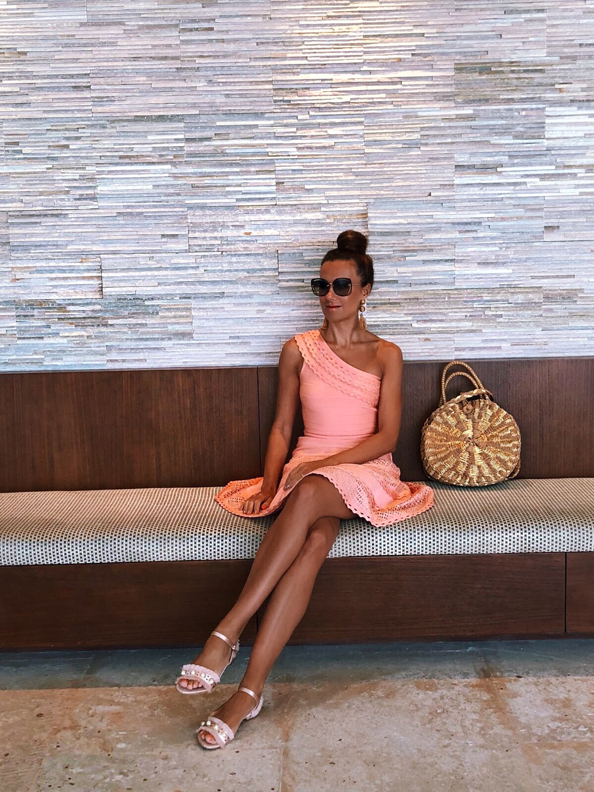 Cancun Mexico | Secrets the Vine hotel Forever Unique Structured One Shoulder Skater Dress With Lace Inserts | Glamorous Pearl Embellished Satin Sandals | Swarovski hoop earrings | Miu Miu sunglasses | ASOS DESIGN Wrapped Bead & Tassel Earrings | South Beach Round Gold Woven Straw Cross Body Bag