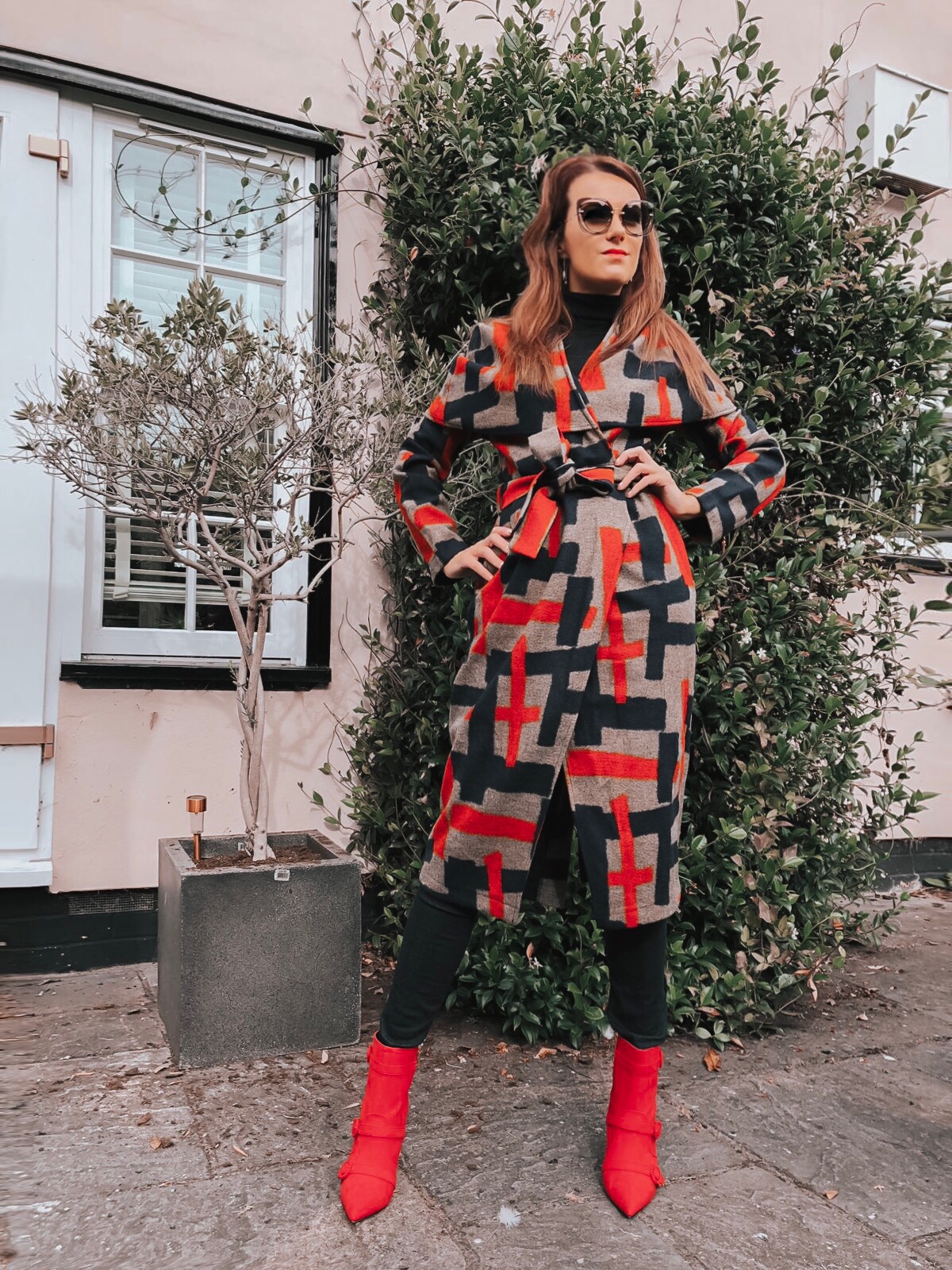 Lavish Alice cape overlay wool coat in abstract print | Faith Buckle Detail Stiletto Boots | Miu Miu Sunglasses | Valentino Red Tote Daybags | Swarovski FANTASTIC CHAIN PIERCED EARRINGS, WHITE | Faith Buckle Detail Stiletto Boot | Replay Luz Mid Rise Rinse Jeans with Contrast Stitch