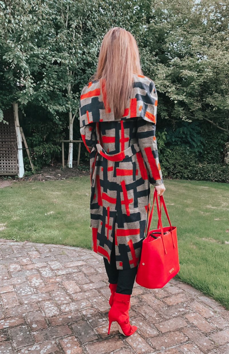 Lavish Alice cape overlay wool coat in abstract print | Faith Buckle Detail Stiletto Boots | Miu Miu Sunglasses | Valentino Red Tote Daybags | Swarovski FANTASTIC CHAIN PIERCED EARRINGS, WHITE | Faith Buckle Detail Stiletto Boot | Replay Luz Mid Rise Rinse Jeans with Contrast Stitch