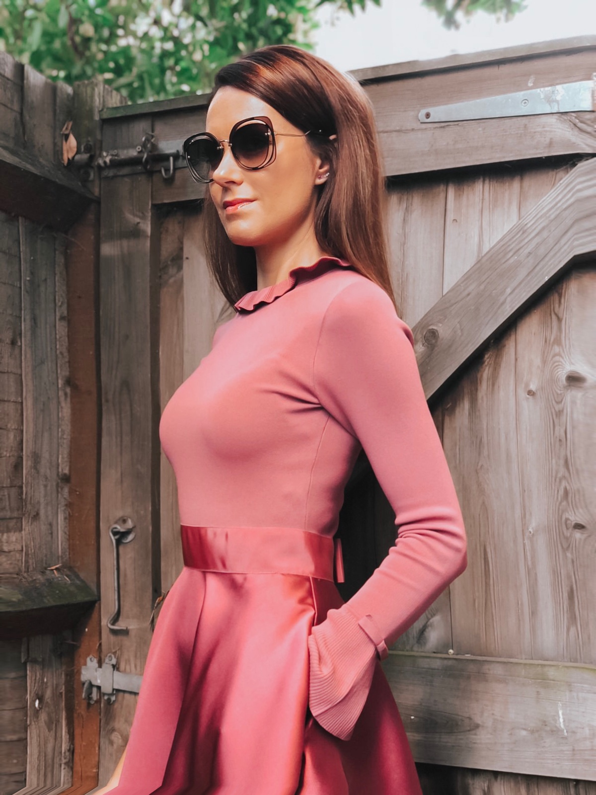 Elegant Duchess Fashion Ted Baker Pink Zadi Skater Dress | Kurt Geiger London Barbican-Wine-(Fabric) Knit Ankle Boot | Miu Miu Sunglasses | Swarovski earrings | Accessorize clutch bag