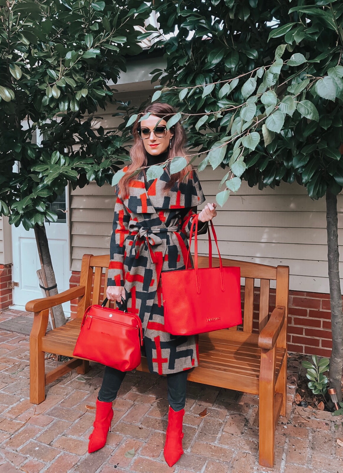 Lavish Alice cape overlay wool coat in abstract print | Faith Buckle Detail Stiletto Boots | Miu Miu Sunglasses | Valentino Red Tote Daybags | Swarovski FANTASTIC CHAIN PIERCED EARRINGS, WHITE | Faith Buckle Detail Stiletto Boot | Replay Luz Mid Rise Rinse Jeans with Contrast Stitch