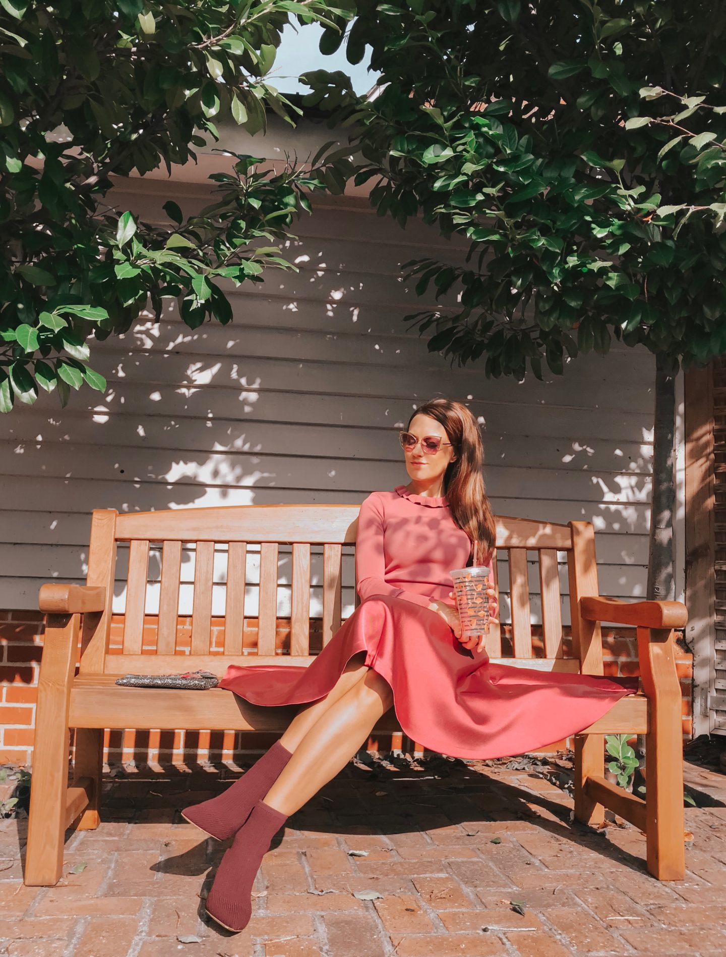 Elegant Duchess Fashion Ted Baker Pink Zadi Skater Dress | Kurt Geiger London Barbican-Wine-(Fabric) Knit Ankle Boot | Miu Miu Sunglasses | Swarovski earrings | Accessorize clutch bag