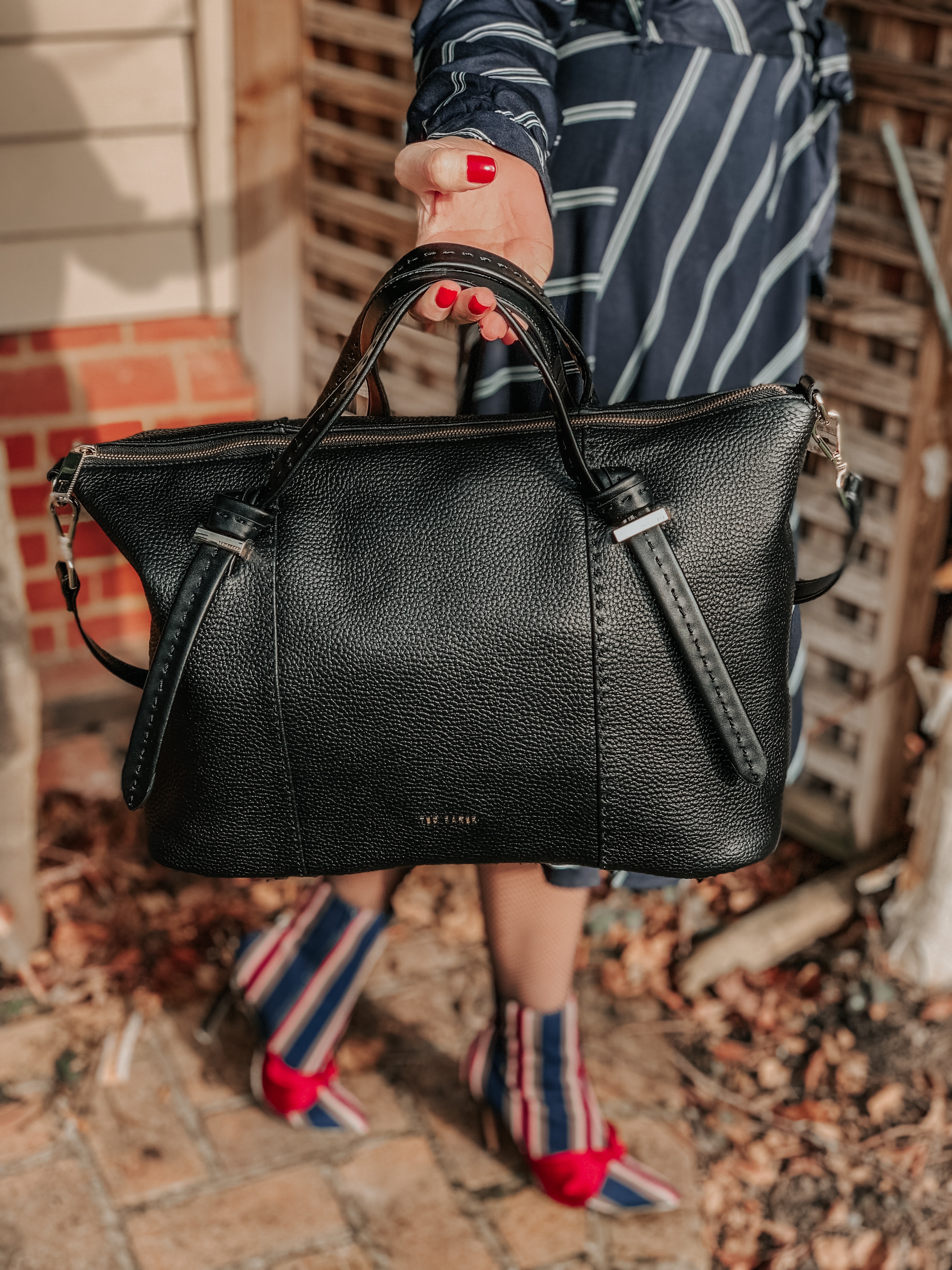 MIU MIU SCENIQUE CUT-OUT EYEWEAR | Vero Moda diagonal stripe shirt dress | Ted Baker Oellie Black Large Handbag | Elegant Duchess Boutique Crystal Flower Brooch | Swarovski Earrings | Charlotte Tilbury make up | ASOS DESIGN Evy stripe bow boots