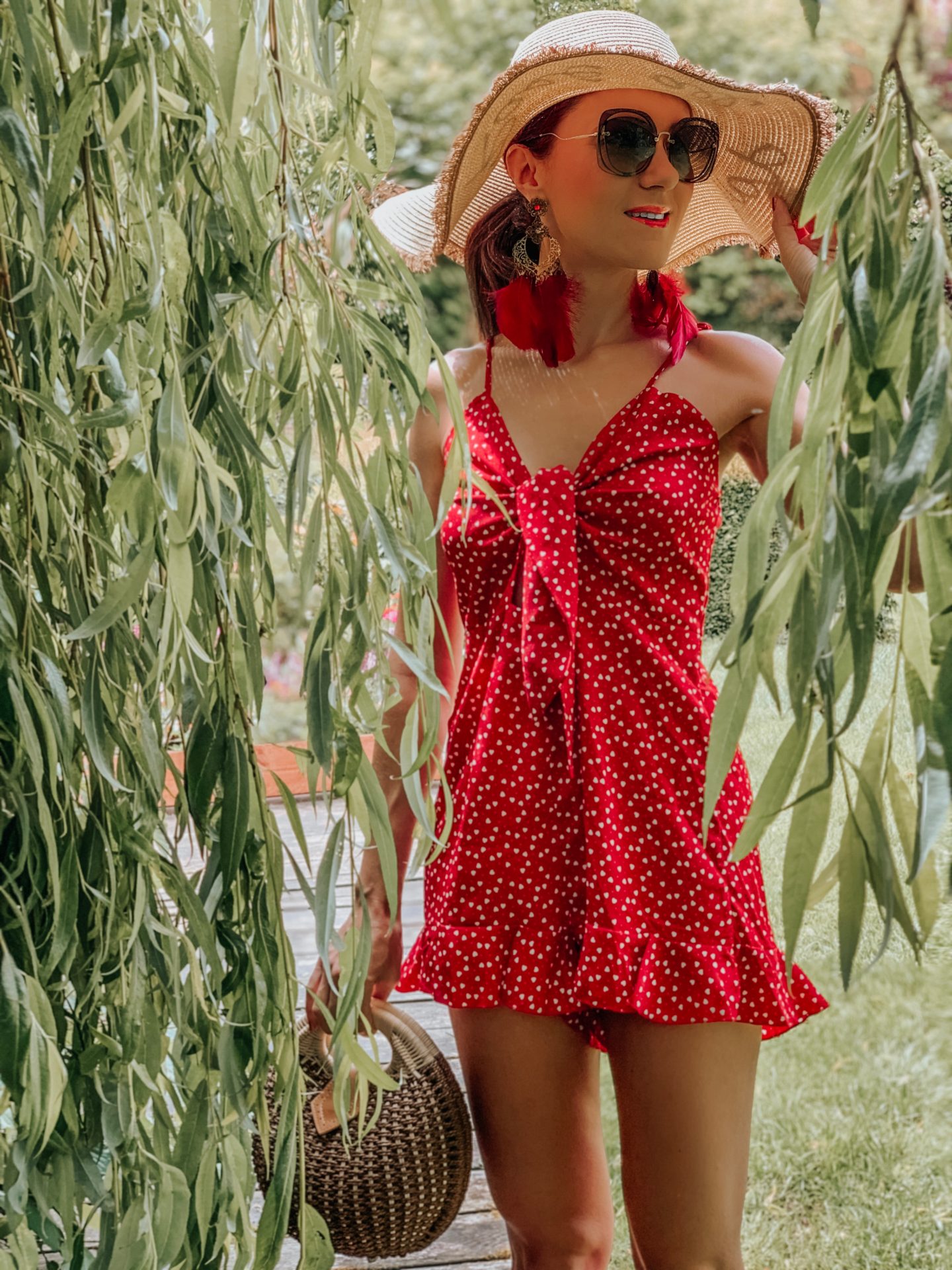 Elegant Duchess Boutique Heart Print Ruffle Hem Knotted Peekaboo effect Romper | Elegant Duchess Boutique Round Summer Beach Straw Bag | Miu Miu Straw Bag