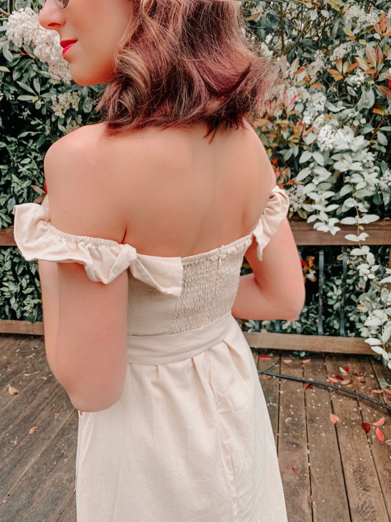 OUTFIT FROM ELEGANT DUCHESS BOUTIQUE Round Summer Beach Straw Bag | Off shoulder ruffle detail midi dress | TEXTURED GEOMETRIC EARRINGS | Pearl Hair Clip | MIU MIU SUNGLASSES