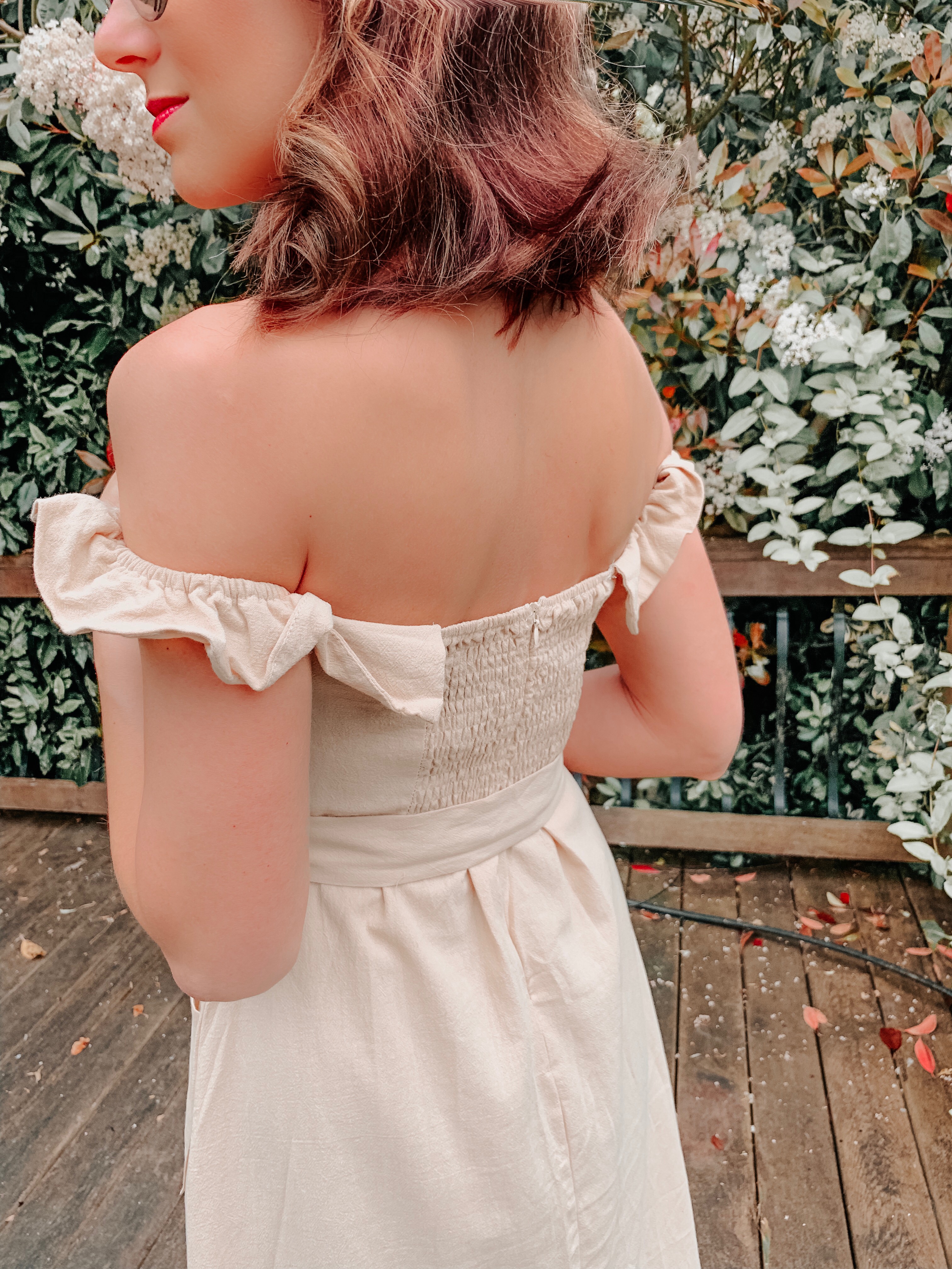OUTFIT FROM ELEGANT DUCHESS BOUTIQUE Round Summer Beach Straw Bag | Off shoulder ruffle detail midi dress | TEXTURED GEOMETRIC EARRINGS | Pearl Hair Clip | MIU MIU SUNGLASSES