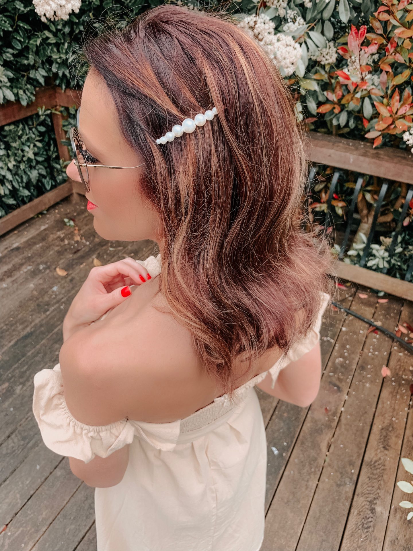 OUTFIT FROM ELEGANT DUCHESS BOUTIQUE Round Summer Beach Straw Bag | Off shoulder ruffle detail midi dress | TEXTURED GEOMETRIC EARRINGS | Pearl Hair Clip | MIU MIU SUNGLASSES