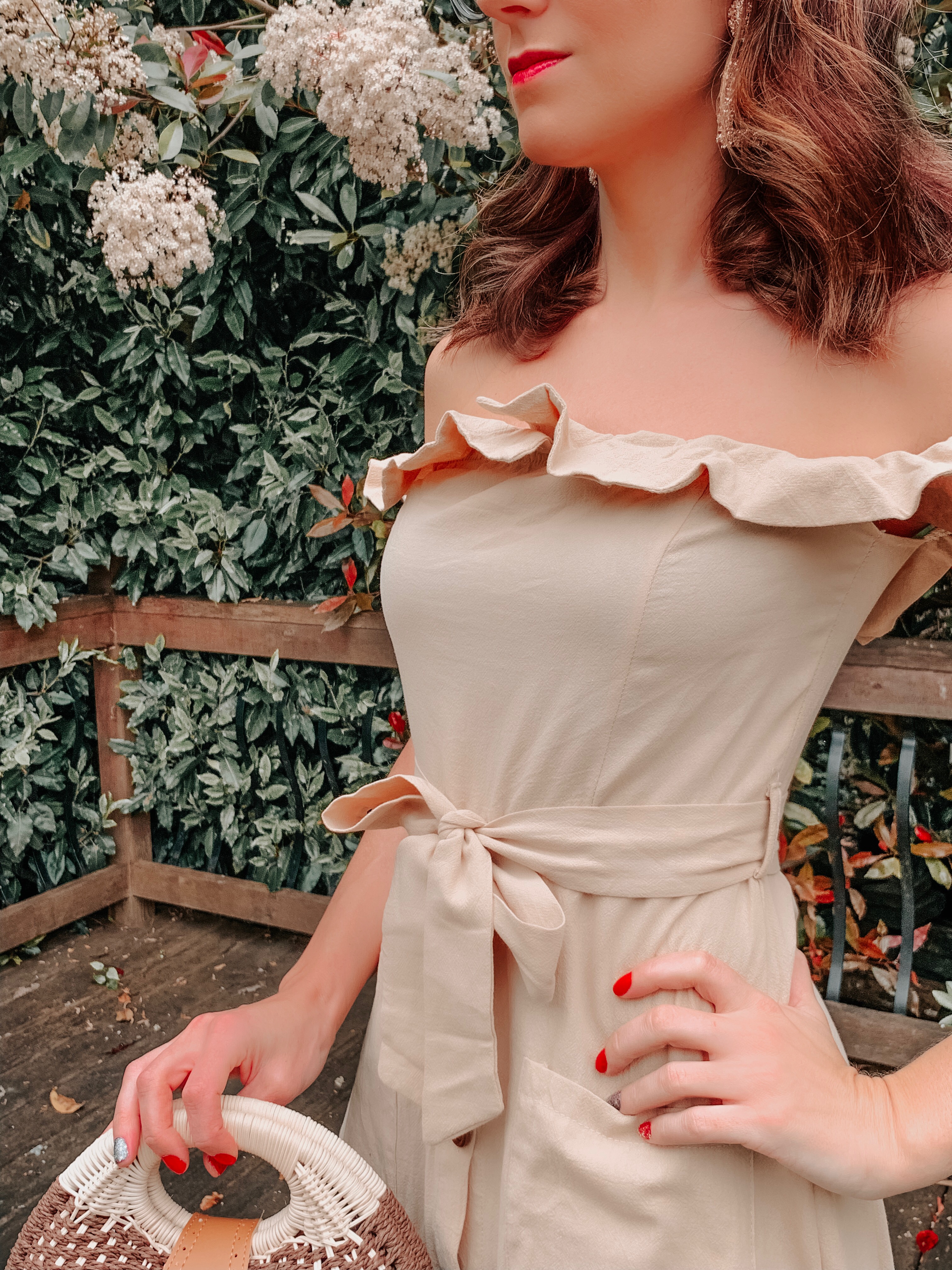 OUTFIT FROM ELEGANT DUCHESS BOUTIQUE Round Summer Beach Straw Bag | Off shoulder ruffle detail midi dress | TEXTURED GEOMETRIC EARRINGS | Pearl Hair Clip | MIU MIU SUNGLASSES
