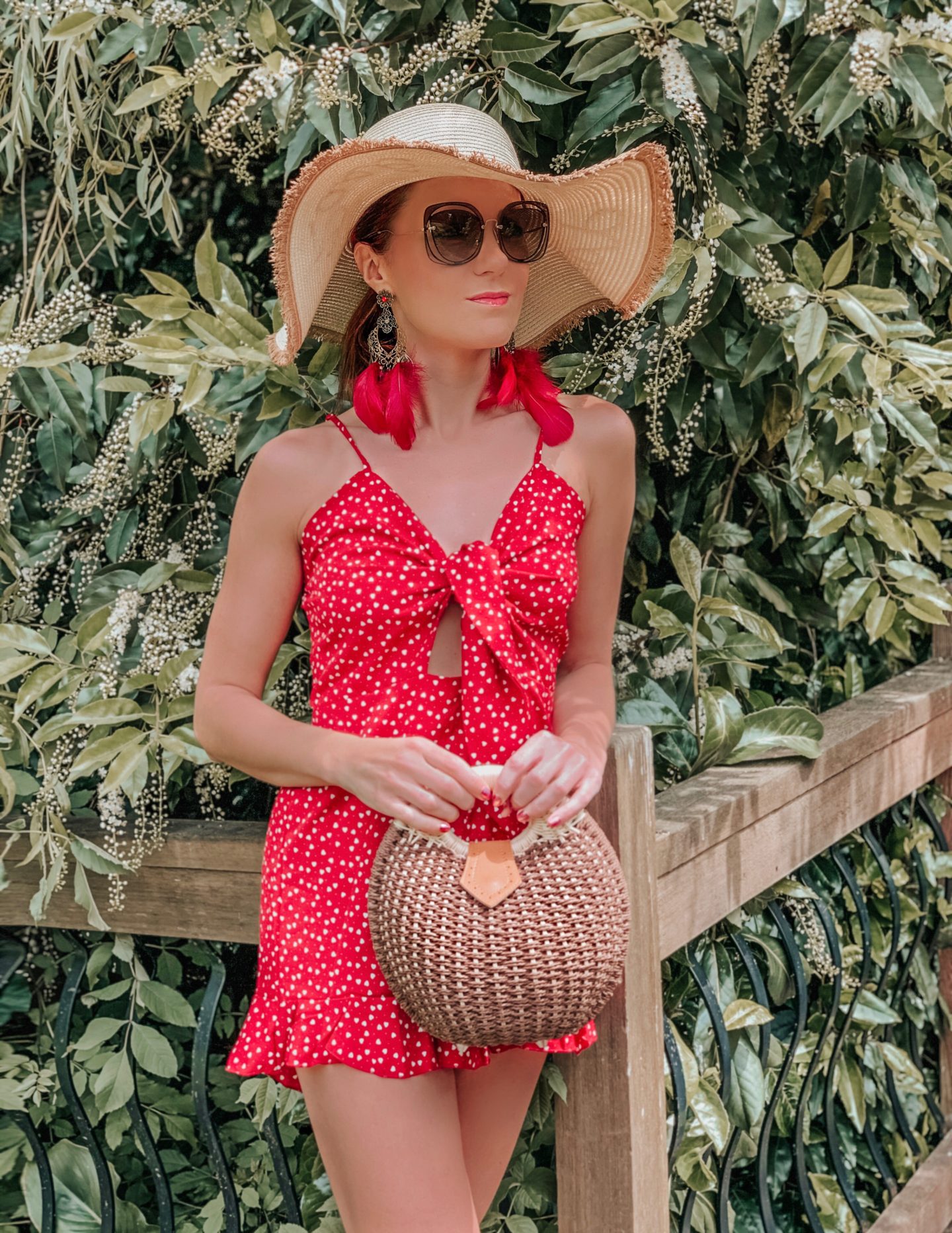 Elegant Duchess Boutique Heart Print Ruffle Hem Knotted Peekaboo effect Romper | Elegant Duchess Boutique Round Summer Beach Straw Bag | Miu Miu Straw Bag