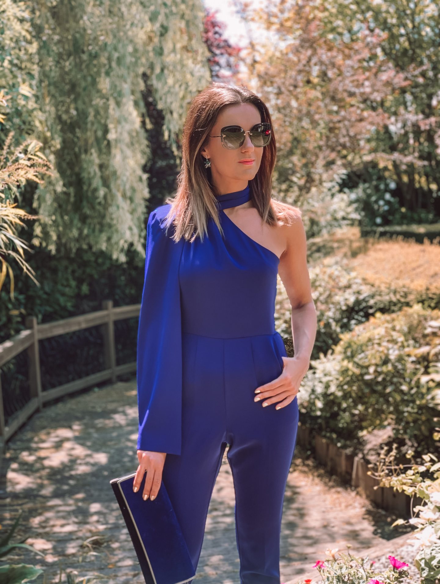 Lavish Alice Cobalt Blue Jumpsuit | Miu Miu sunglasses | Swarovski earrings