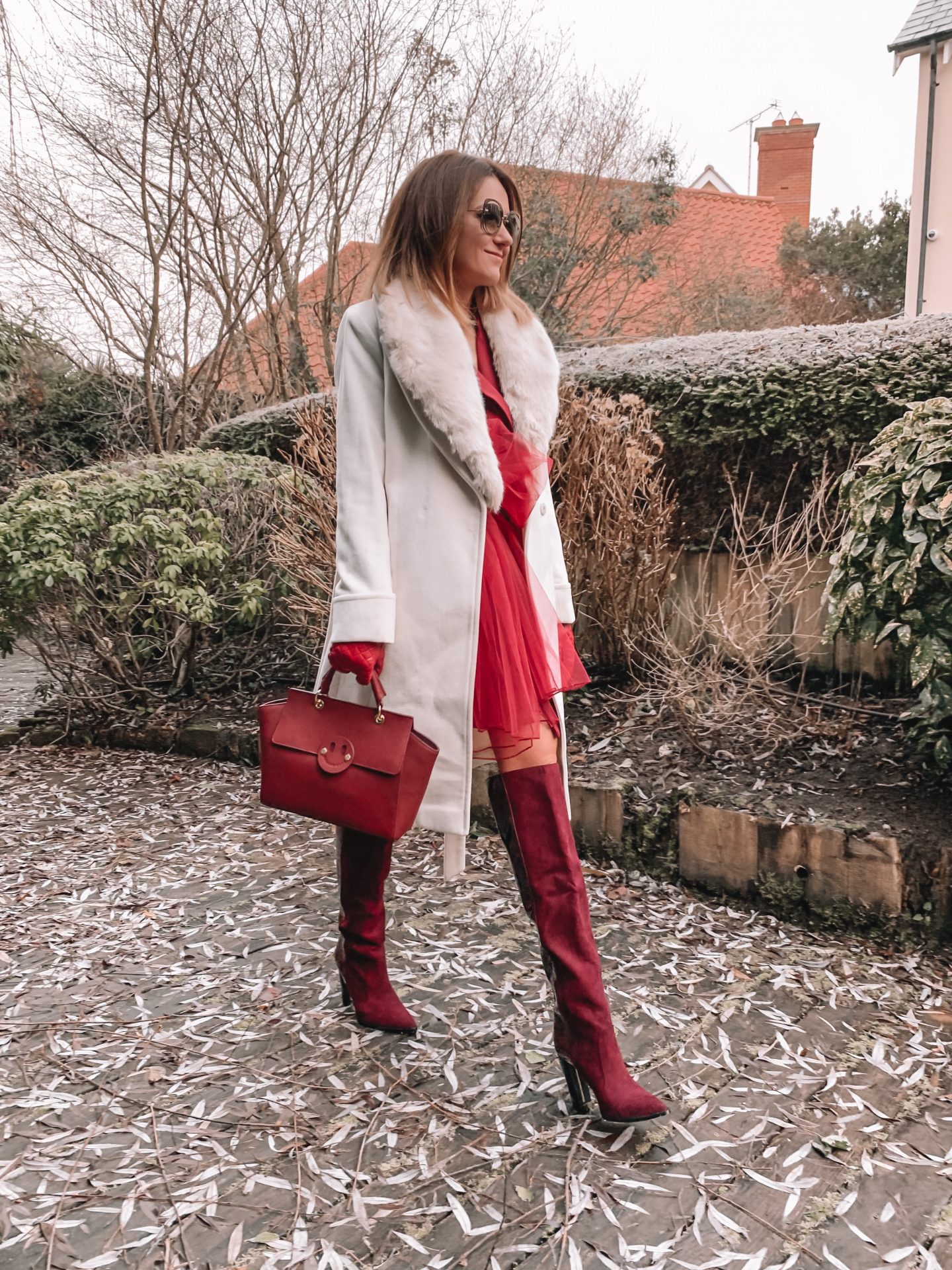 Missguided blazer dress with mesh bow waist detail in burgundy | Miu Miu sunglasses | Dune burgundy gloves | Mix/Hill & Friends Satchel Bag | Lauren Ralph Lauren® Faux Fur Trim Wool Wrap Coat | River Island Red Dark High Wide Leg Boots