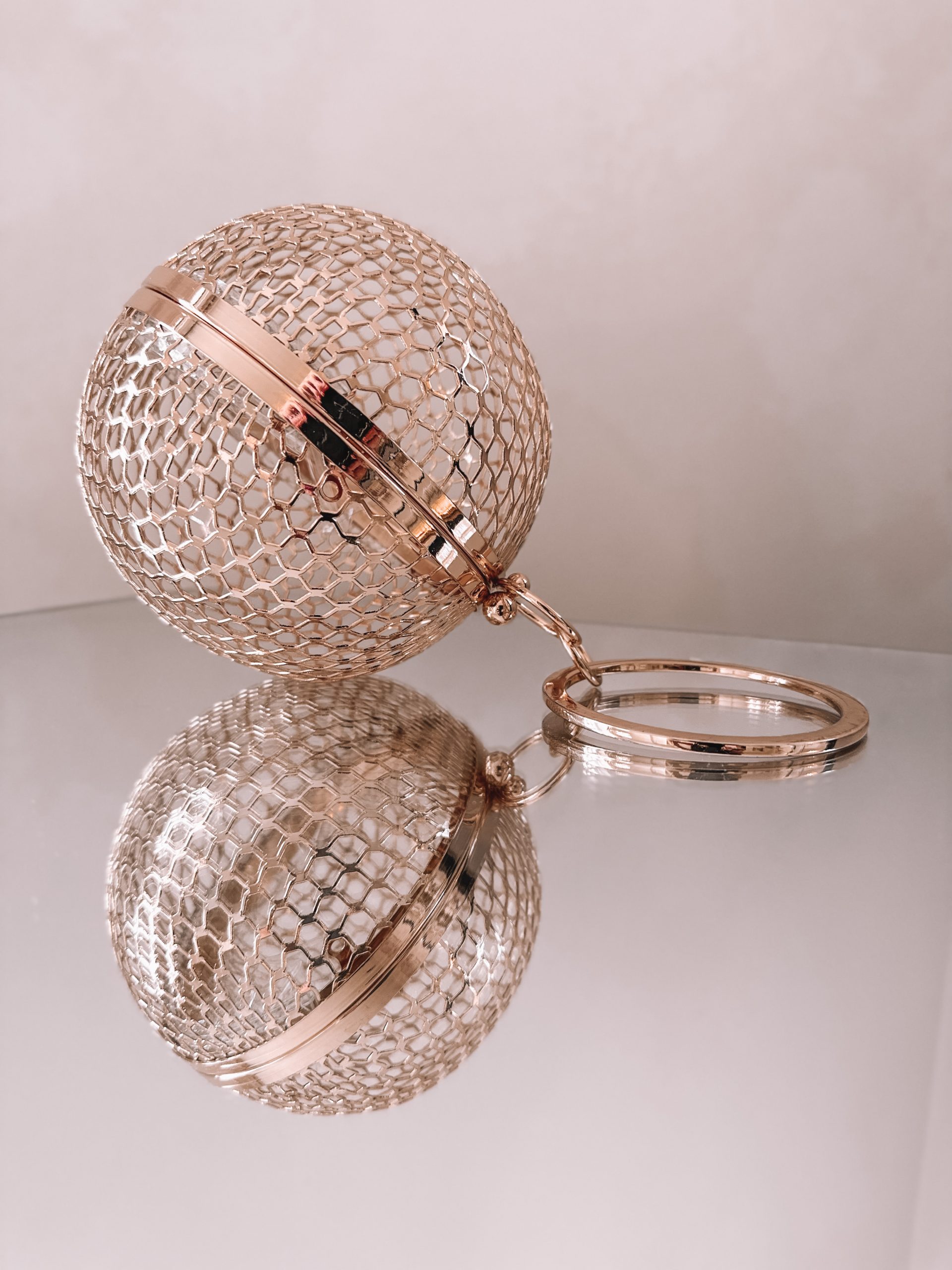 ASOS DESIGN cage sphere clutch bag in gold