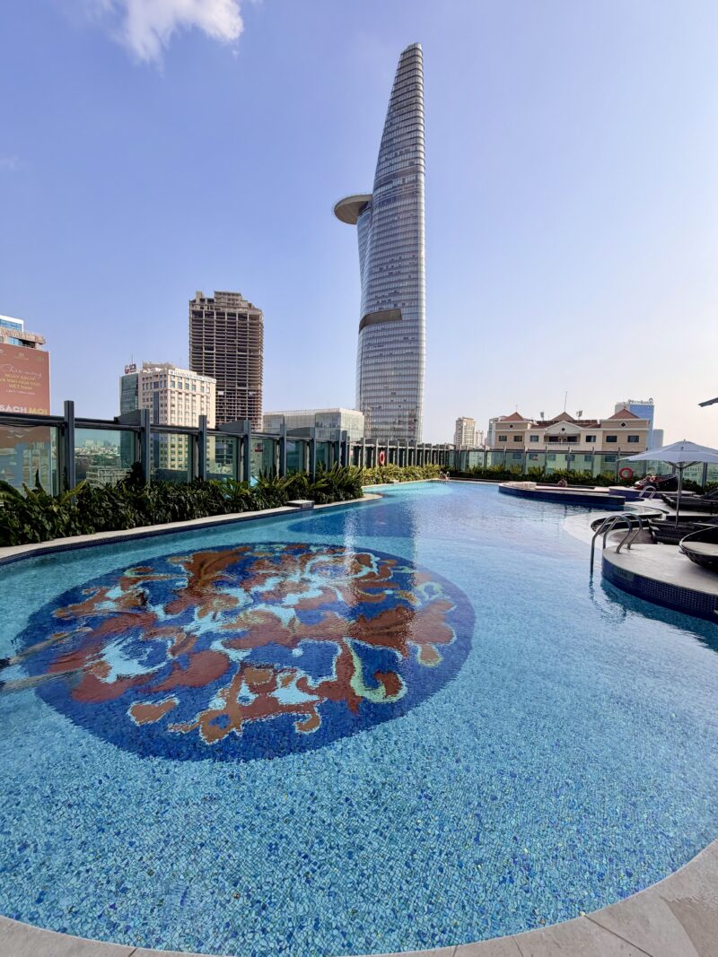 Outdoor pool at The Reverie Saigon surrounded by loungers in the heart of Ho Chi Minh City Outdoor pool at The Reverie Saigon surrounded by loungers in the heart of Ho Chi Minh City