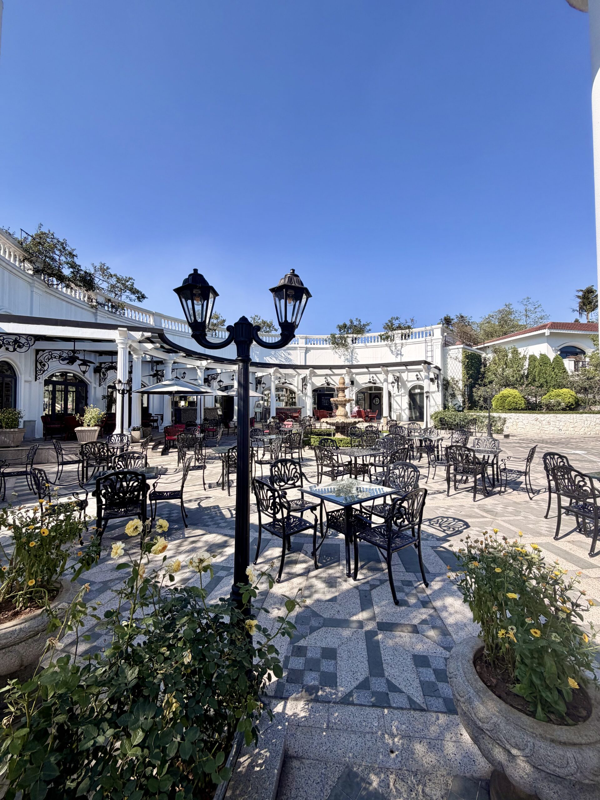 Outdoor garden dining at The Yard, Silk Path Grand Sapa Resort, Vietnam Outdoor garden dining at The Yard, Silk Path Grand Sapa Resort, Vietnam